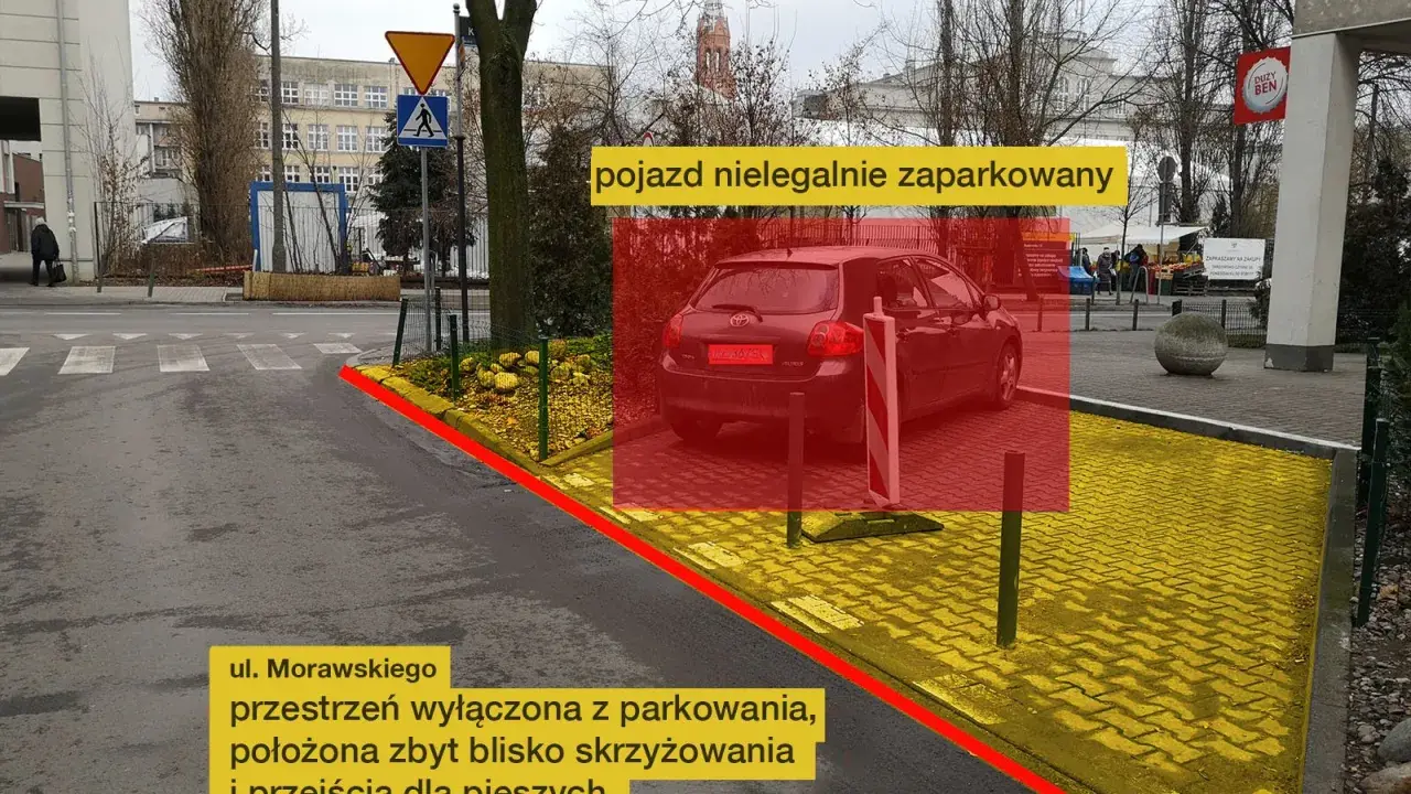 Nielegalnie zaparkowany pojazd na ul. Morawskiego. Przestrzeń wyłączona z parkowania, zbyt blisko skrzyżowania i przejścia dla pieszych.