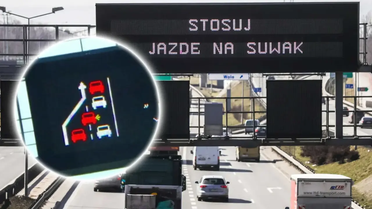 Zbliżenie na ekran z grafiką samochodów i znak drogowy z napisem "STOSUJ JAZDĘ NA SUWAK".