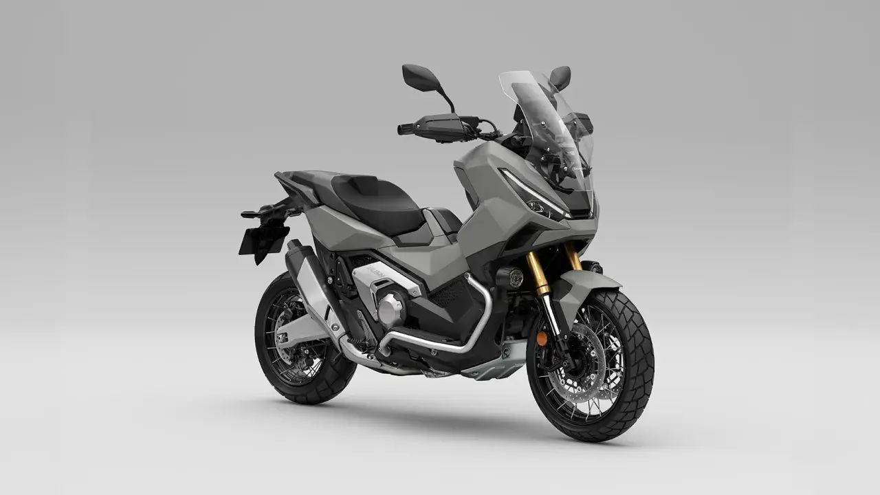 Szary skuter Honda X-ADV 750 z przygodowym zacięciem, gotowy na każdą trasę.