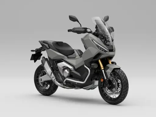 Szary skuter Honda X-ADV 750 z przygodowym zacięciem, gotowy na każdą trasę.
